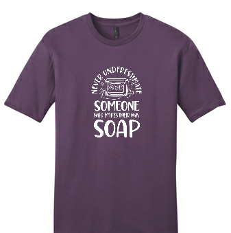 Plum colored t-shirt with the words "Never underestimate someone who makes their own soap"