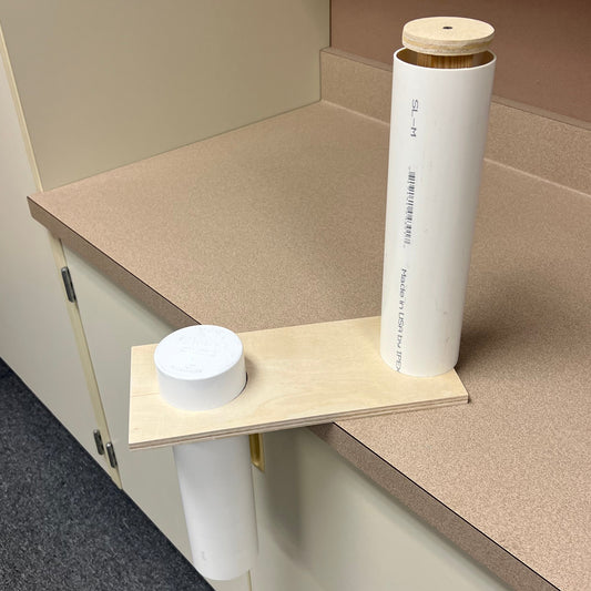 Wooden device to push soap out of a 3" pipe and remove the cap from the pipe mold.