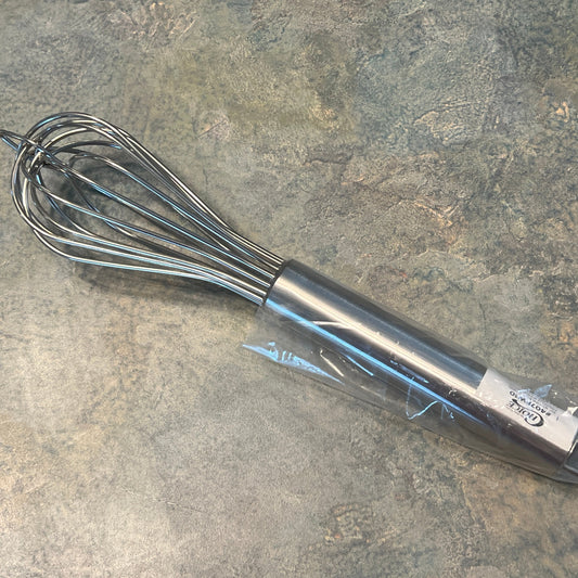 A stainless steel whisk with a looped handle, displayed on a textured background.