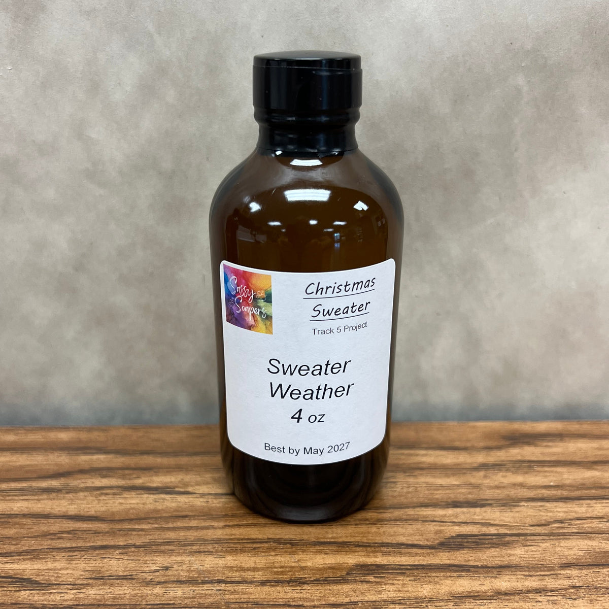 4 ounce brown bottle of fragrance oil Sweater Weather.