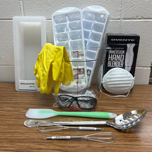 Soapmaking equipment bundle including a 6 liter bowl, 2 ice cube trays, chemical resistant gloves, 10" loaf mold, PH strips, safety goggles, a hand blender, dust mask, heat safe spatula, stainless steel spoon and 2 six inch colorant whisks.