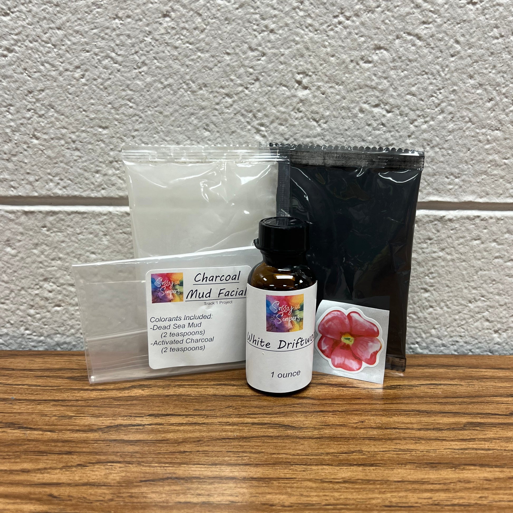 Plastic packets of colorant and bottle of fragrance oil for soap making.