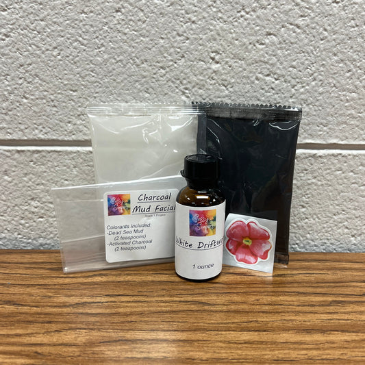 Plastic packets of colorant and bottle of fragrance oil for soap making.