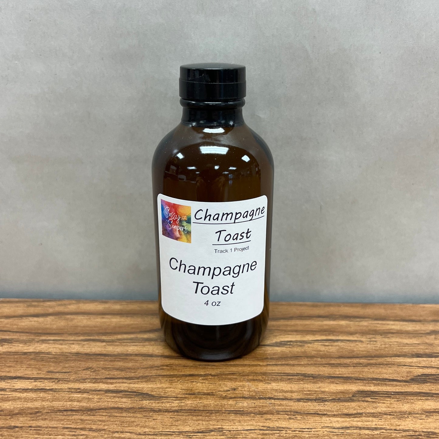 4 ounce brown bottle of Champagne Toast fragrance oil.