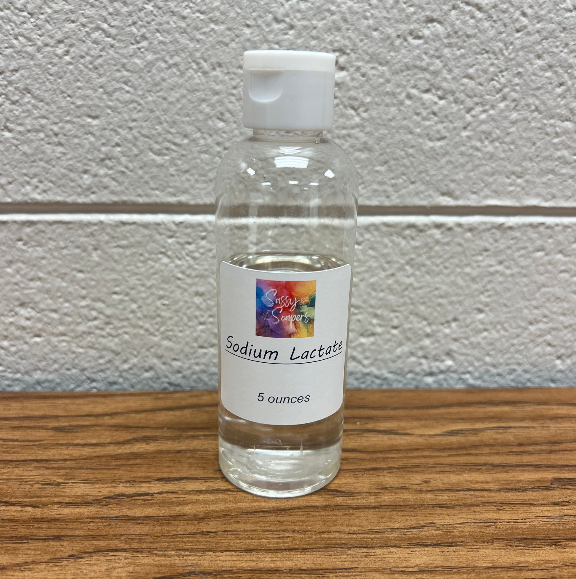 Clear plastic bottle containing 5 oz of sodium lactate