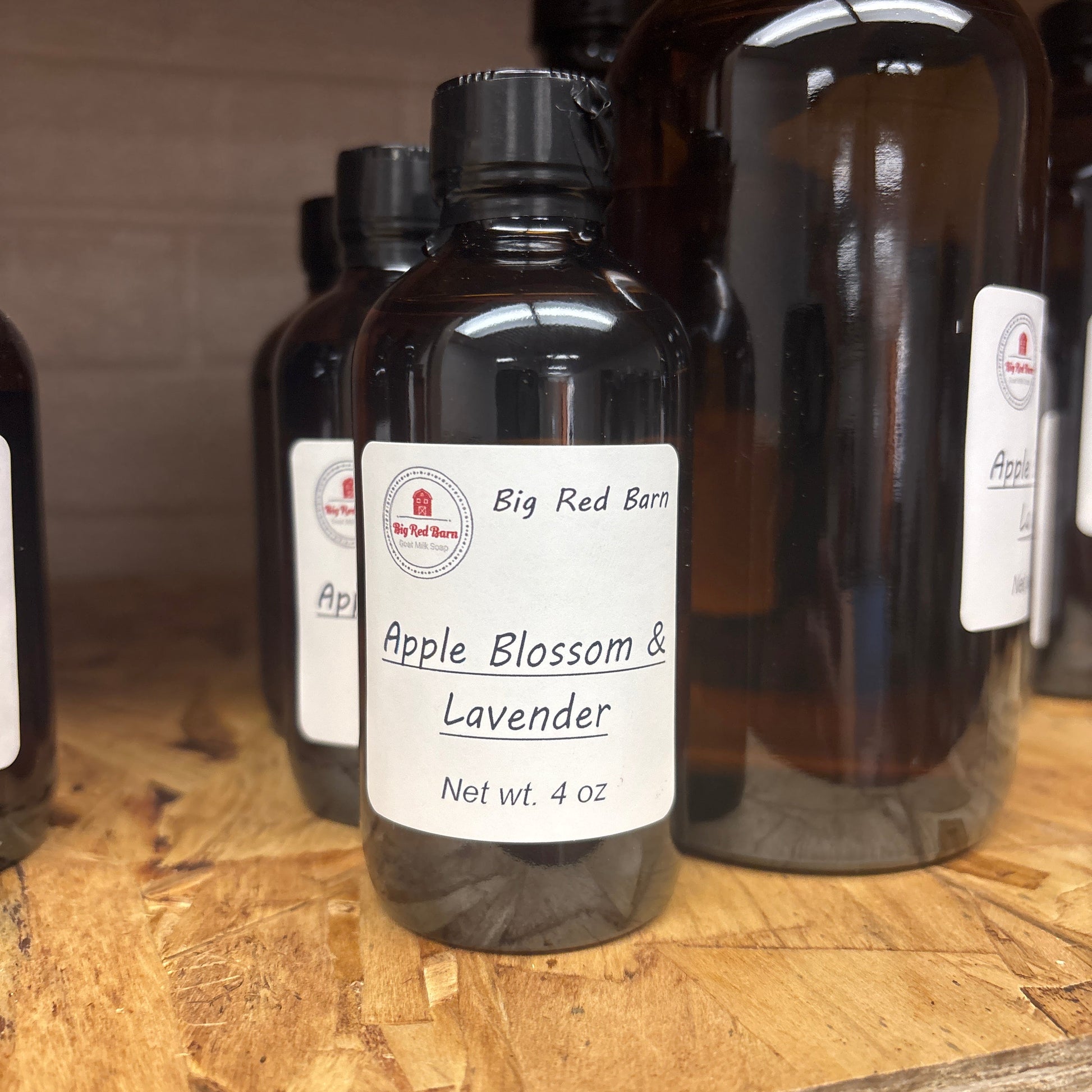 Apple Blossom Lavender fragrance bottle on a wooden surface