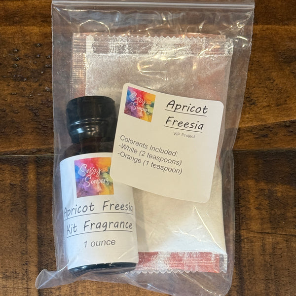 Apricot Freesia fragrance kit with bottle and packaging on a wooden surface