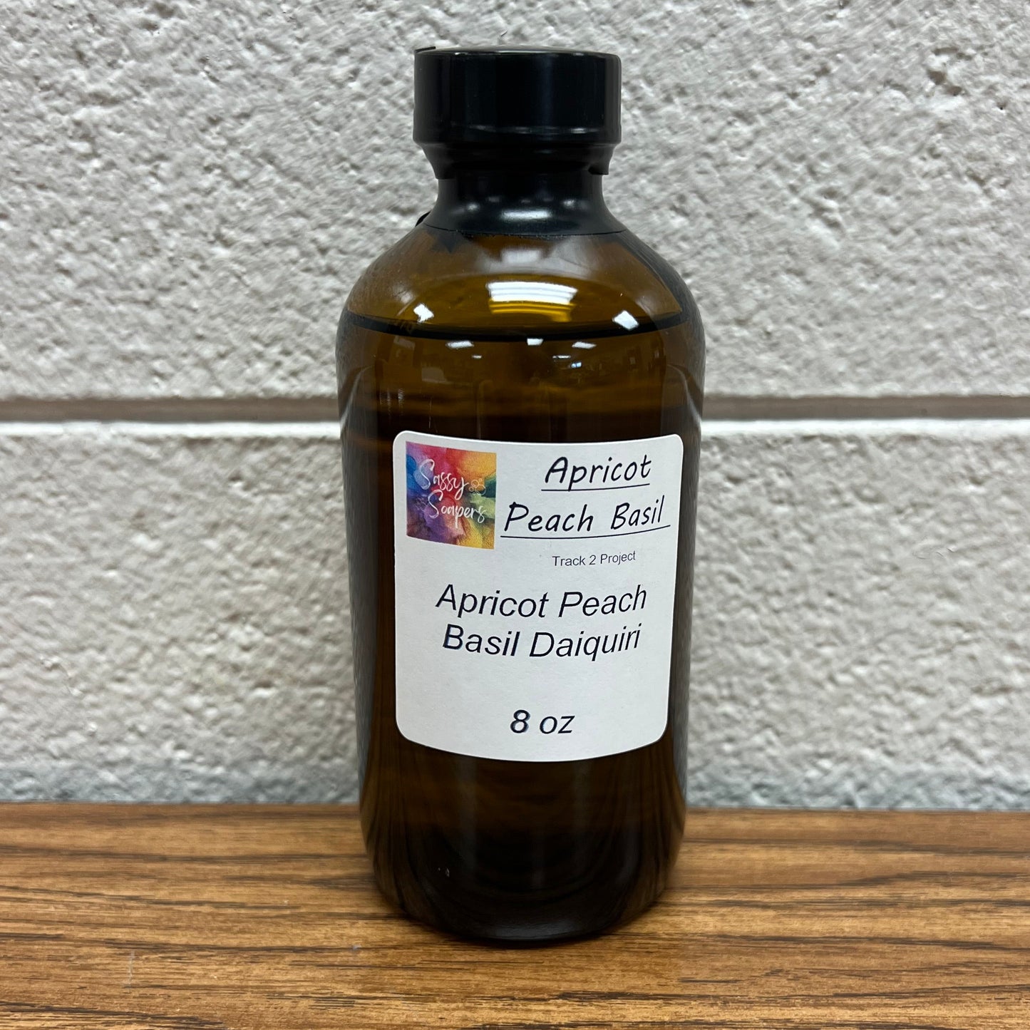Brown 8 oz bottle of Apricot Peach Basil Daiquiri fragrance oil