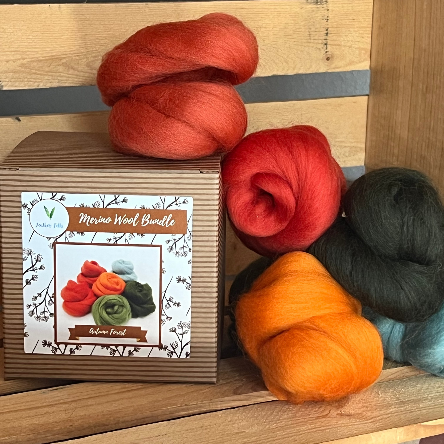 Assorted orange, green, red, and blue wool bundles