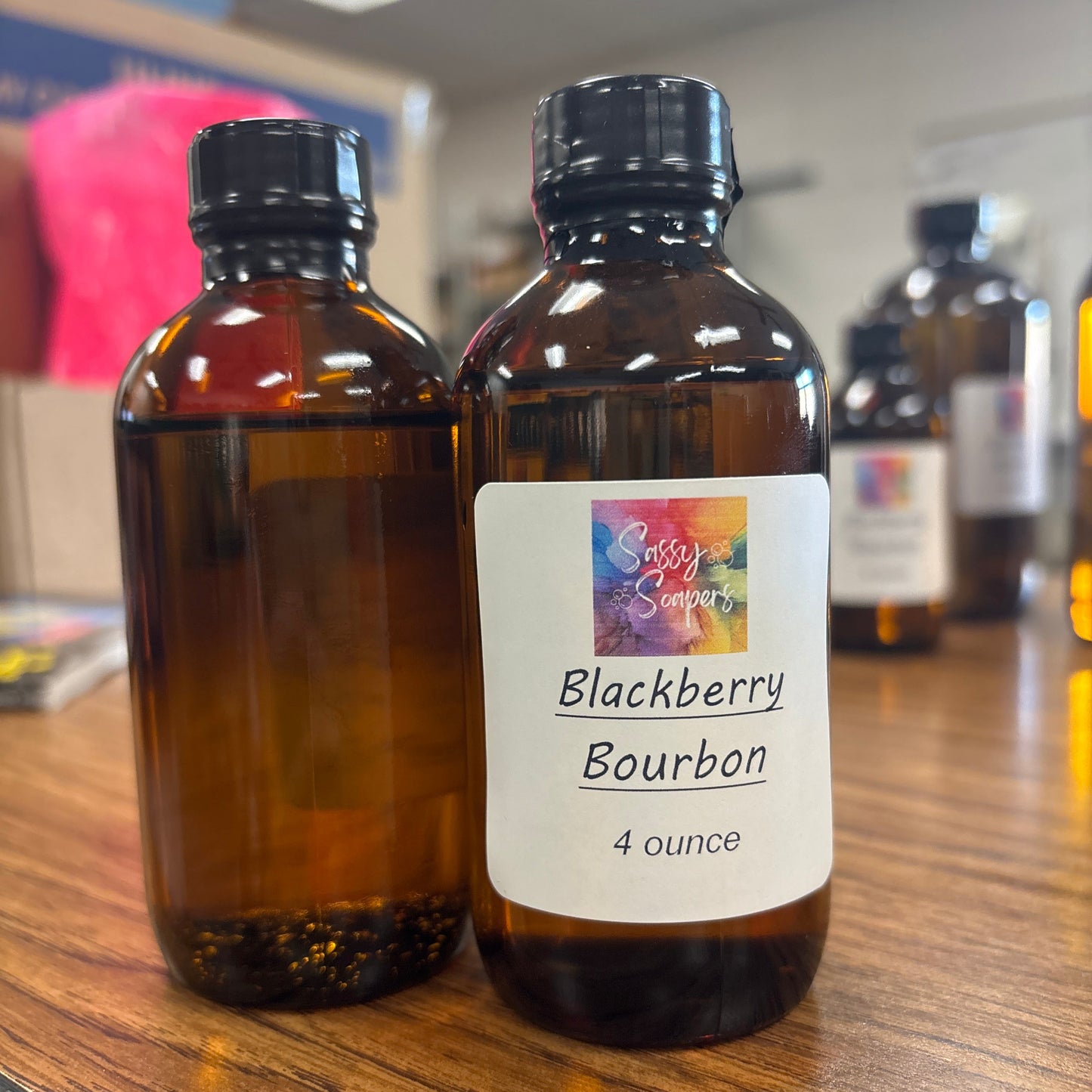Bottle of Blackberry Bourbon fregrence oils on a wooden surface
