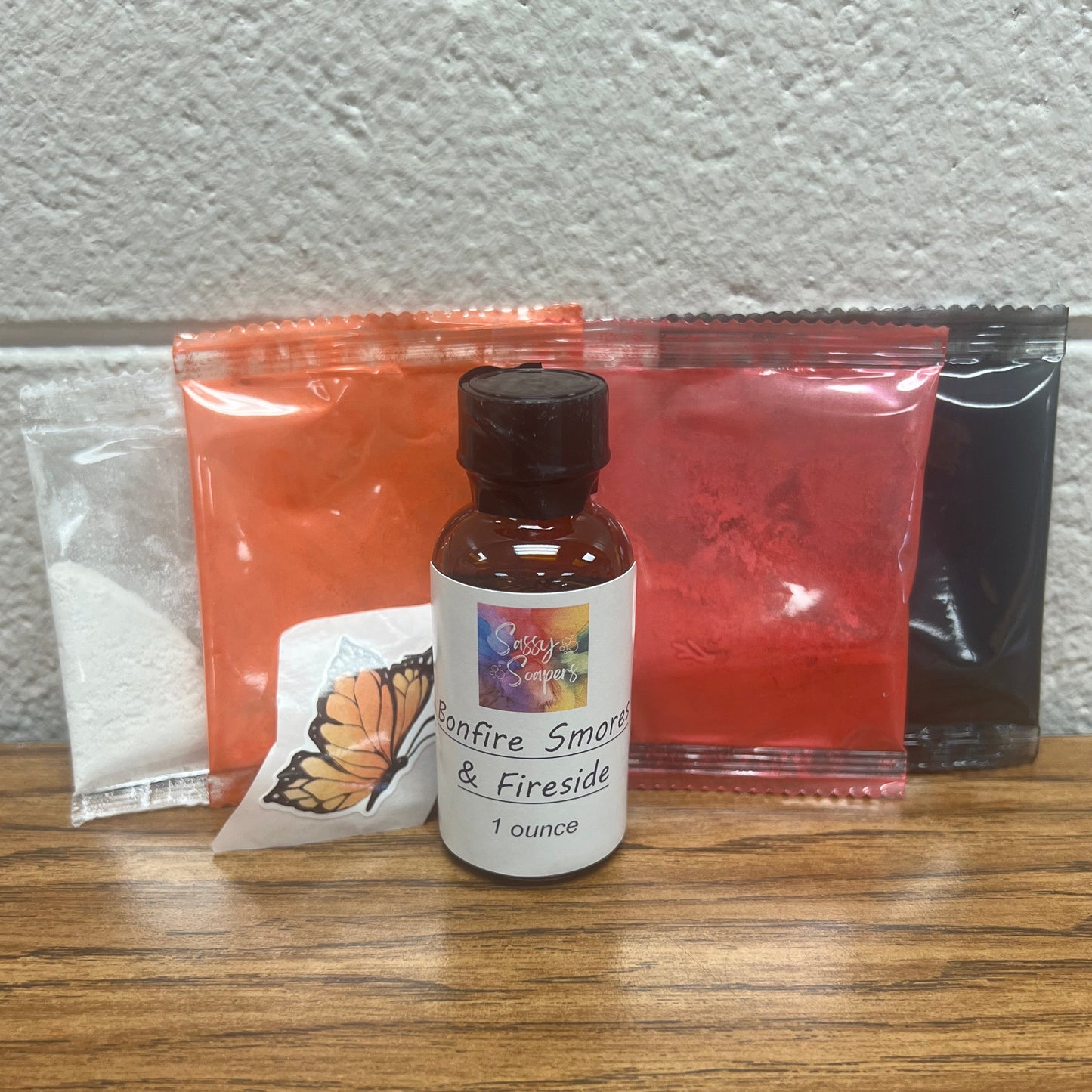 Kit containing Bonfire fragrance, white, orange, red and black colorants.