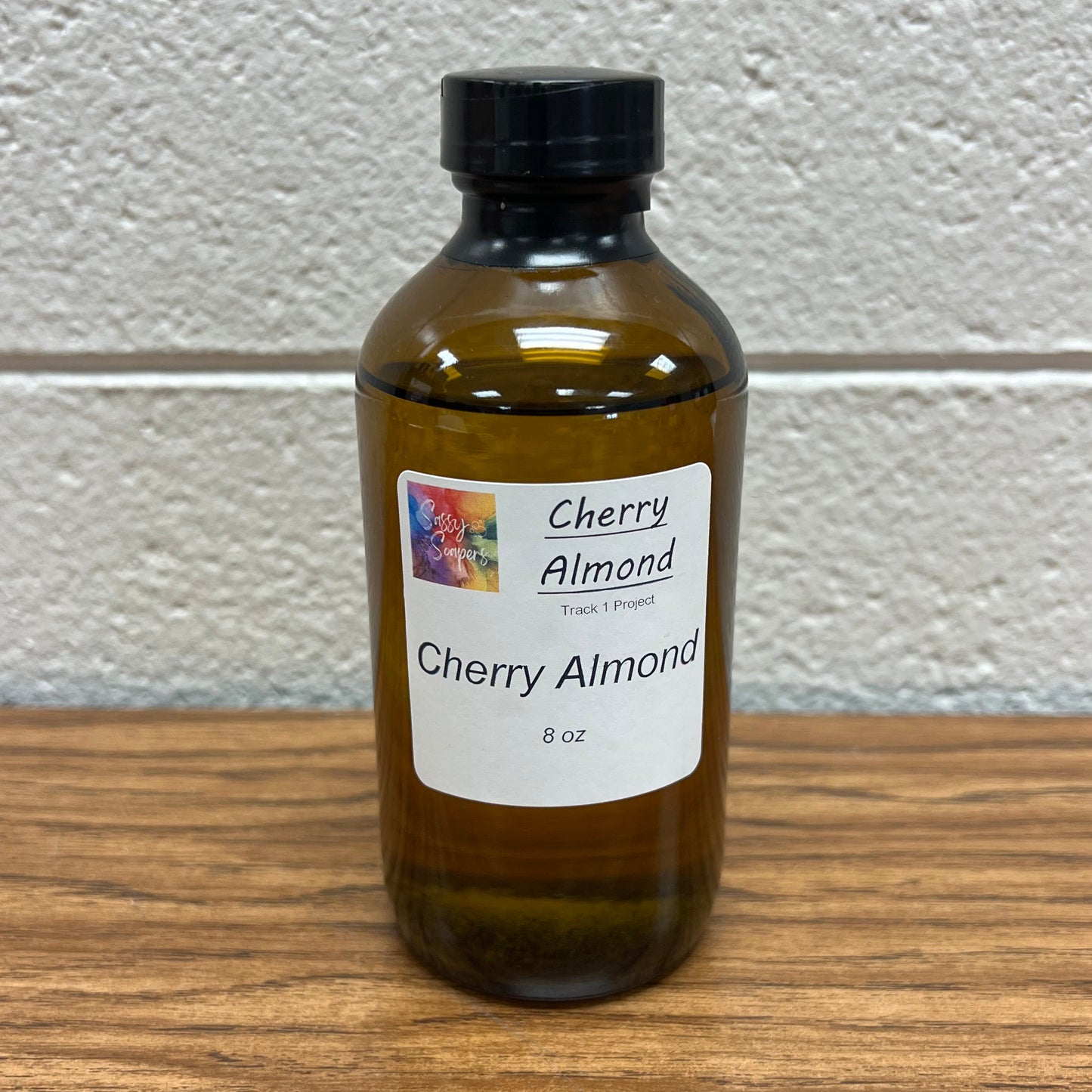 Brown 8 oz glass bottle of Cherry Almond fragrance oil