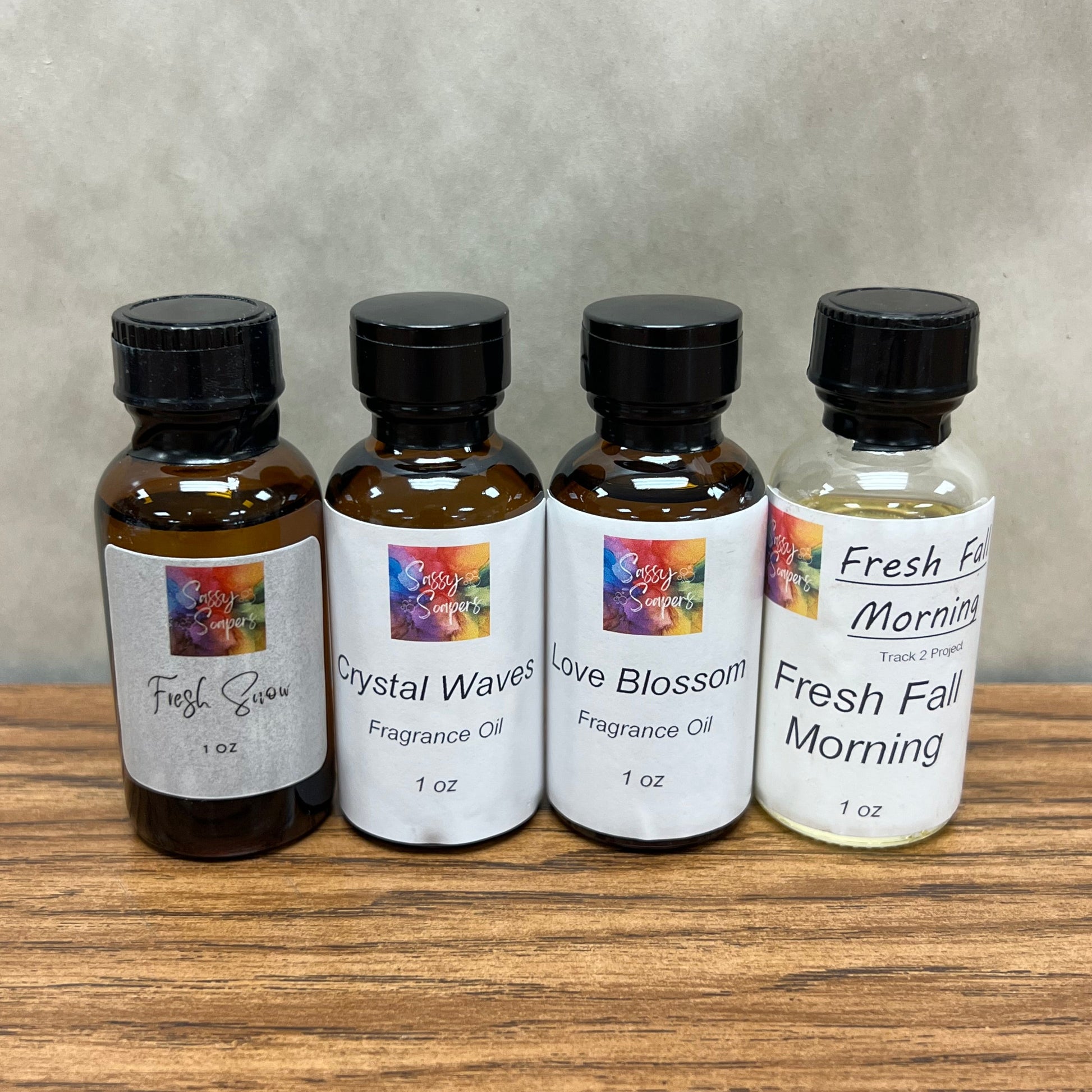 Set of 4, one ounce bottles of fragrance oils for soap and lotion making. Fresh Snow, Crystal Waves, Love Blossom and Fresh Fall Morning.