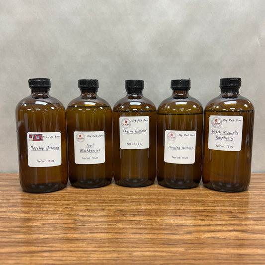 Five, 6 ounce brown bottles of fragrance oils - Rosehip Jasmine, Iced Berries, Cherry Almond, Dancing Waters and Peach Magnolia Raspberry.