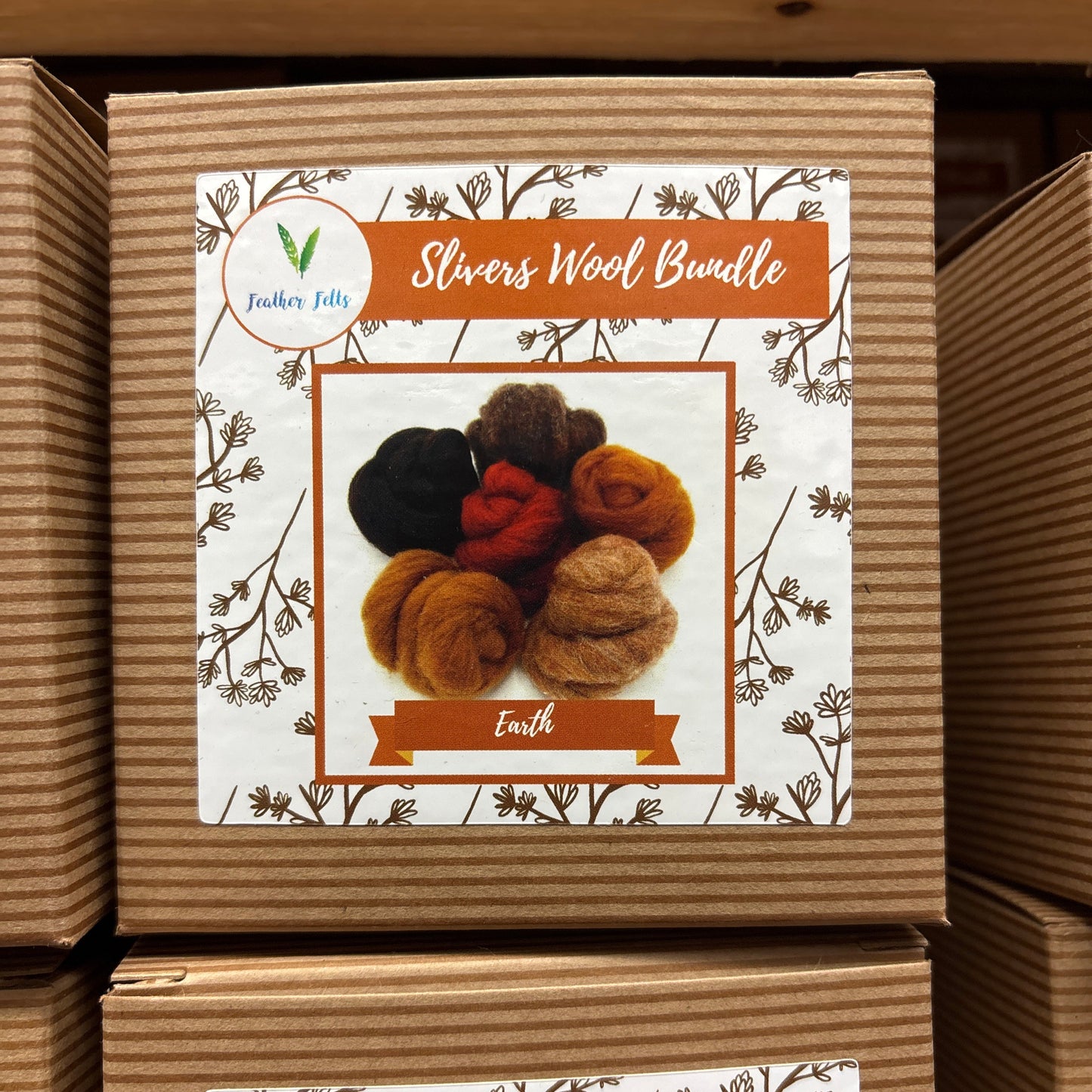 Box of Slivers Wool Bundle with decorative label on a wooden surface