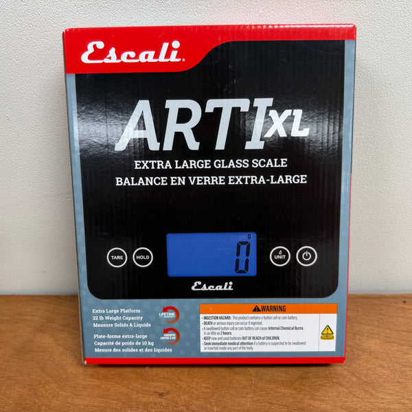 Escali Art XL digital scale packaging on a wooden surface with a white background
