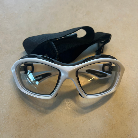 Goggles with white around them used for soap making