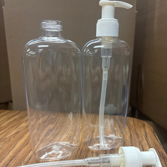 Clear plastic bottles with white pump dispensers on a wooden surface