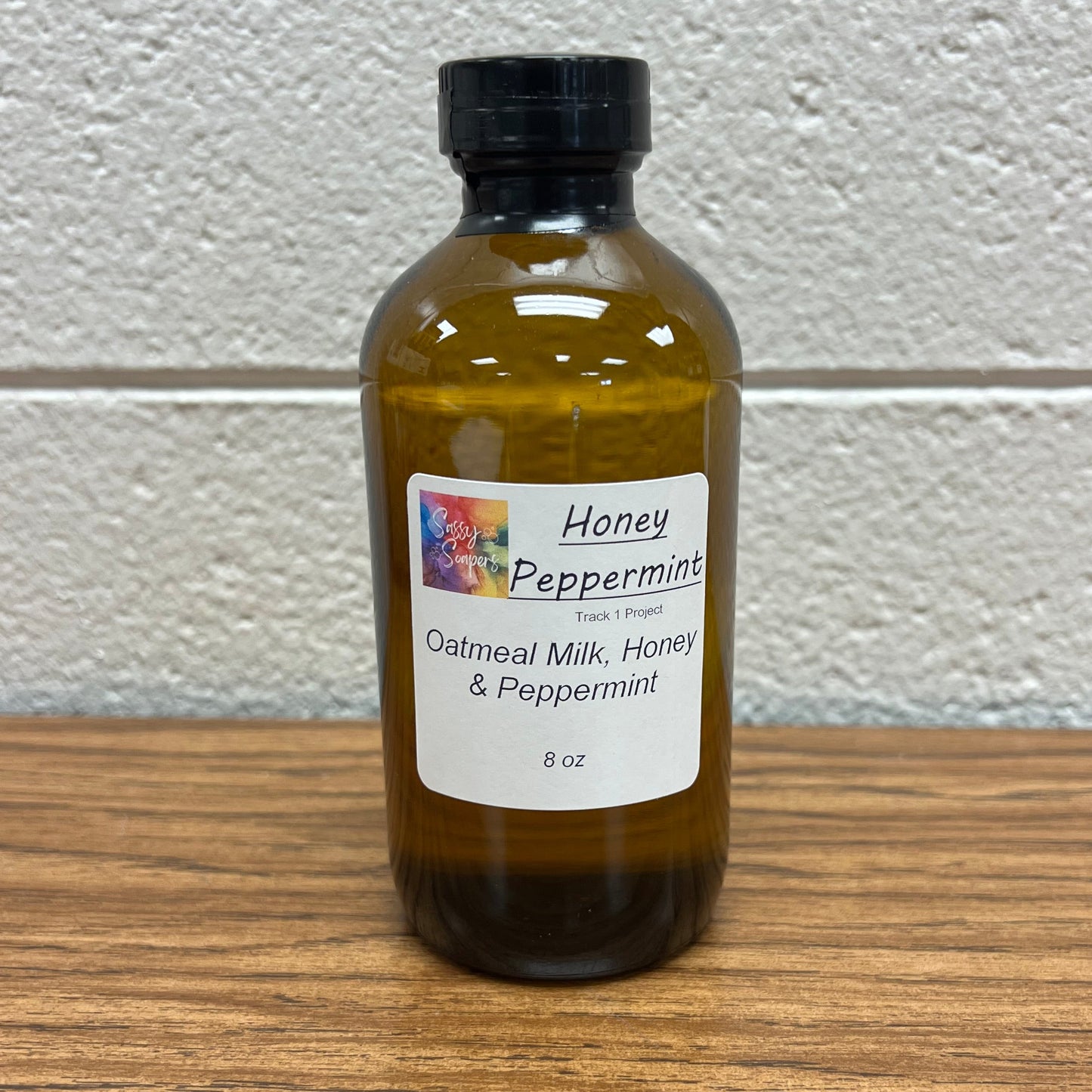 Brown 8 oz glass bottle of Oatmeal Milk and Honey Peppermint Fragrance Oil.