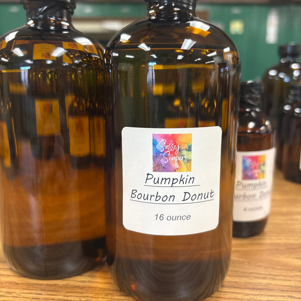 Bottle of Pumpkin Bourbon Donut fragrence oils on a wooden surface