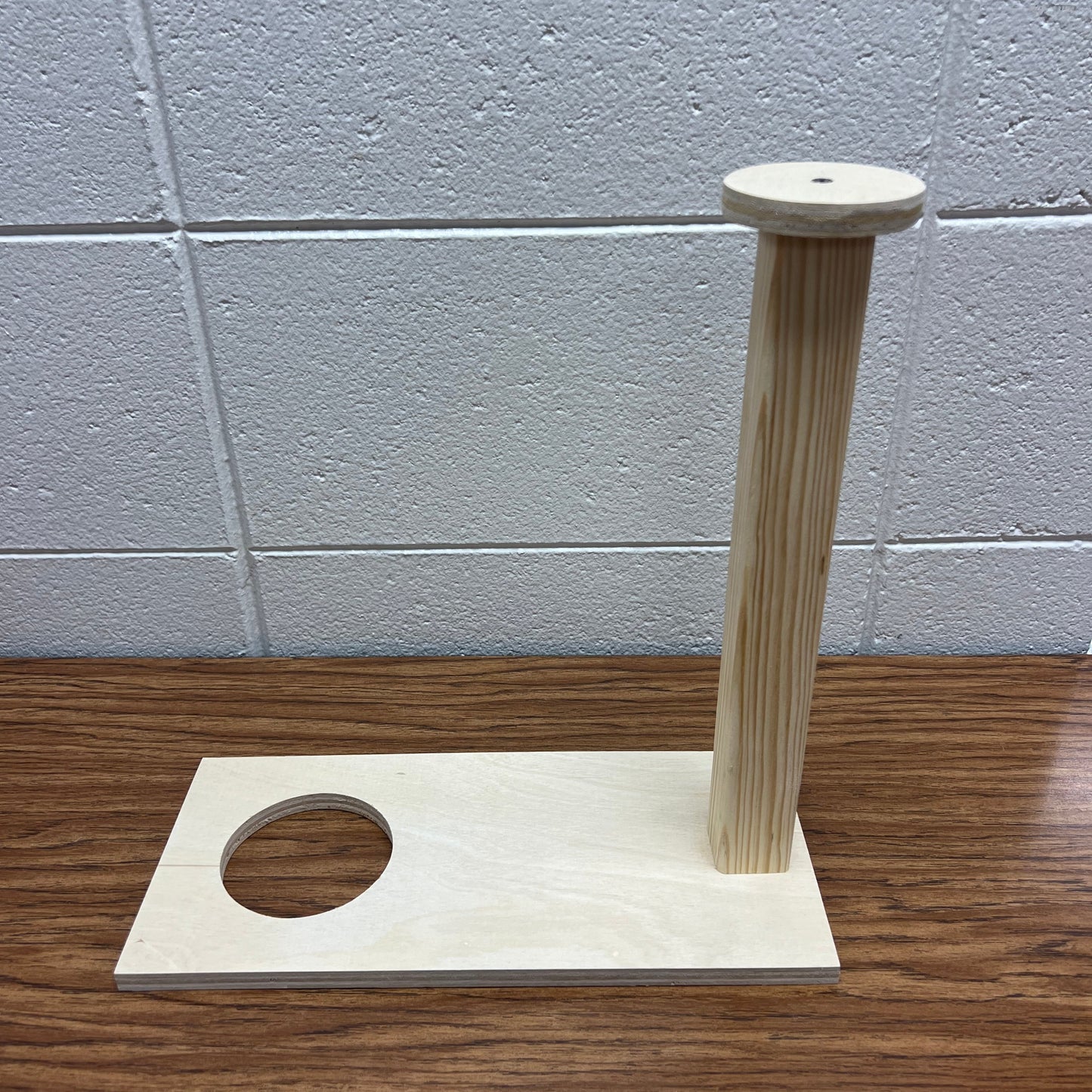 Wooden device to push soap out of a 3" pipe and remove the cap from the pipe mold.