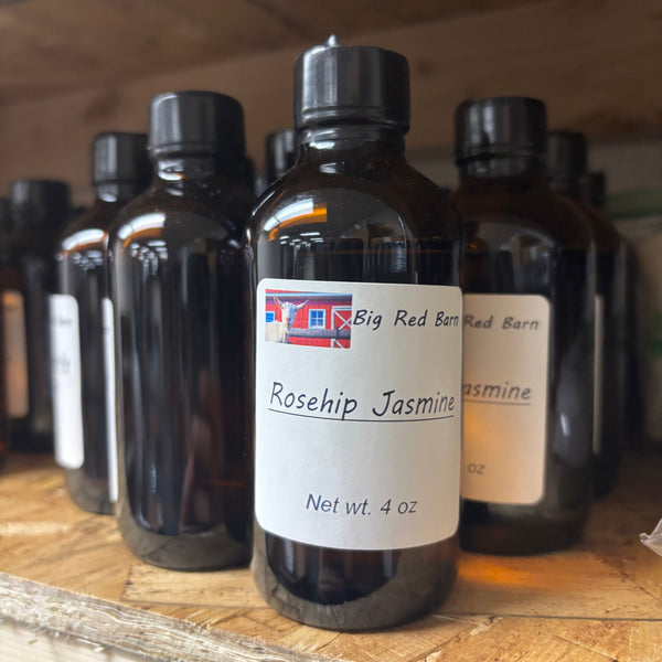 bottle of fragrance oil sitting on a table