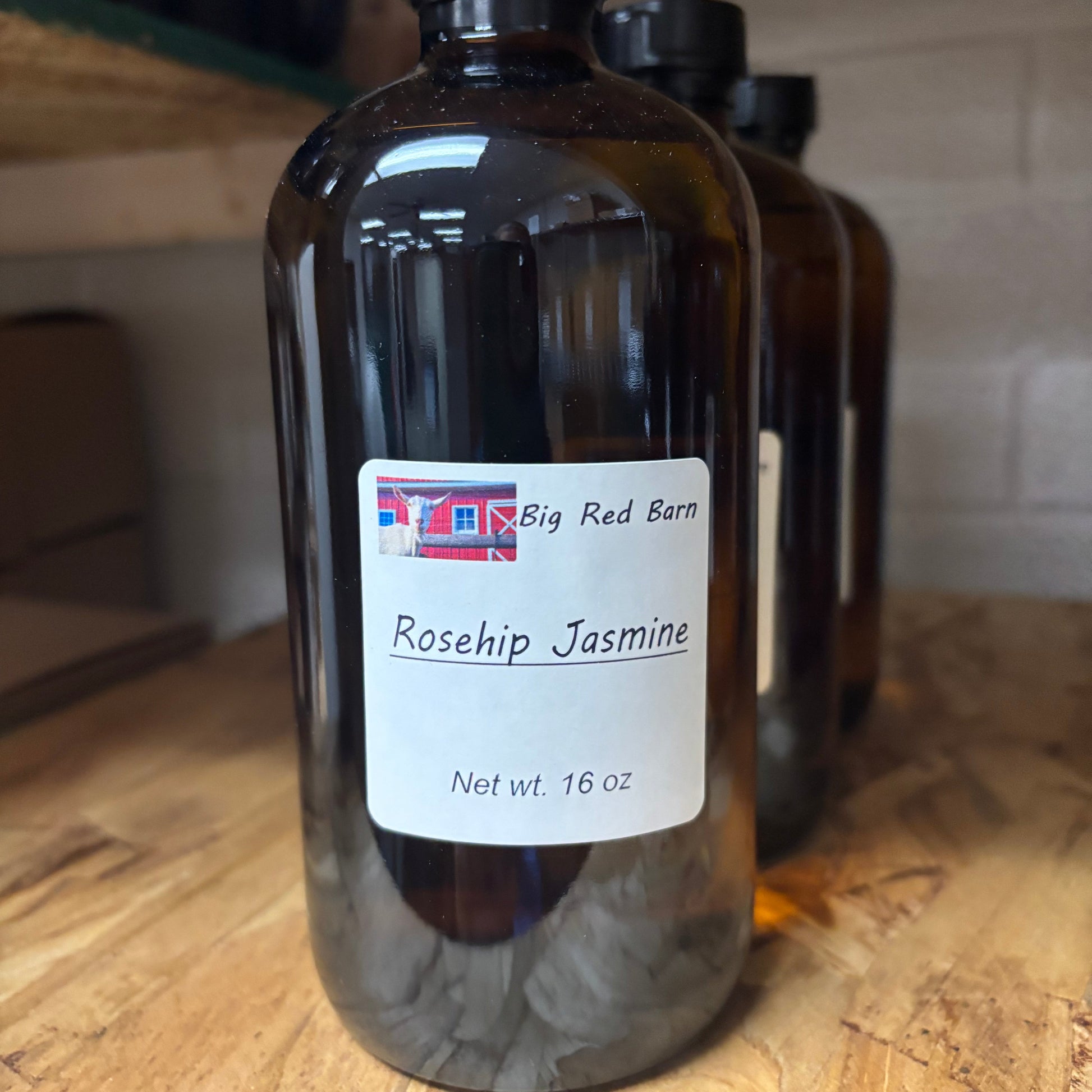 bottle of fragrance oil sitting on a table