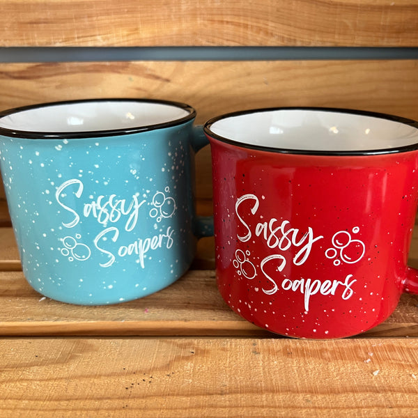 blue and red mugs sitting on a wooden shelf