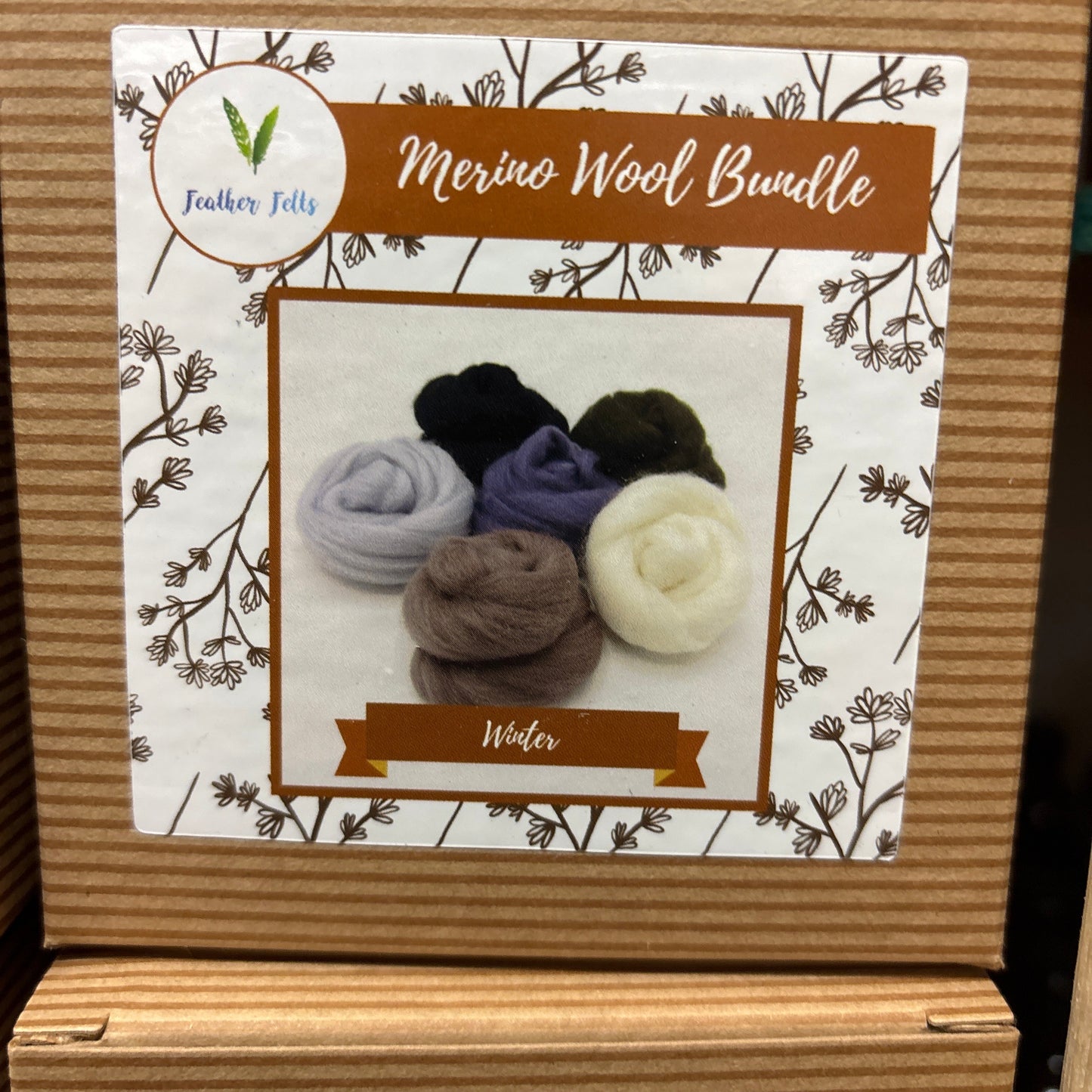 Wool Bundle packaging with wool balls on a decorative label.