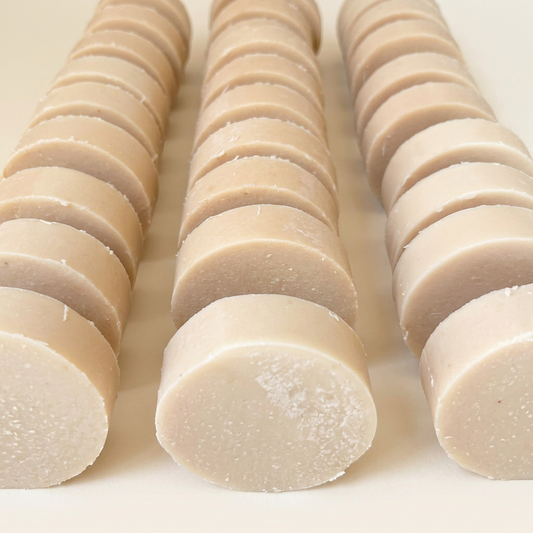 Round soaps organized into tidy rows