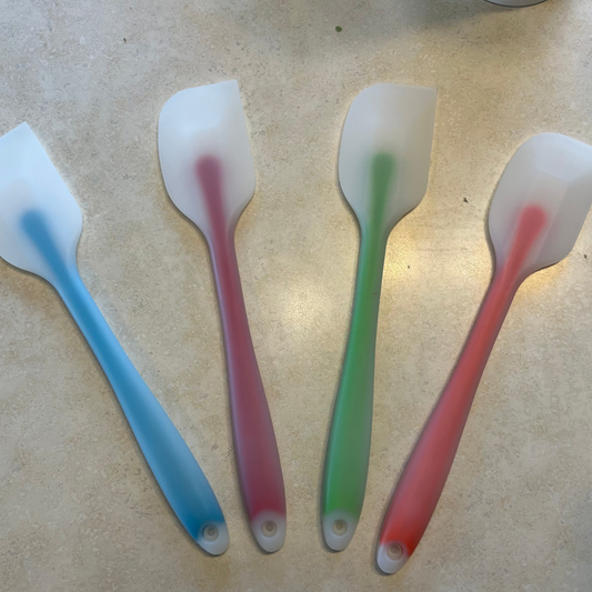blue, red, green, orange rubber spatulas with white tips 